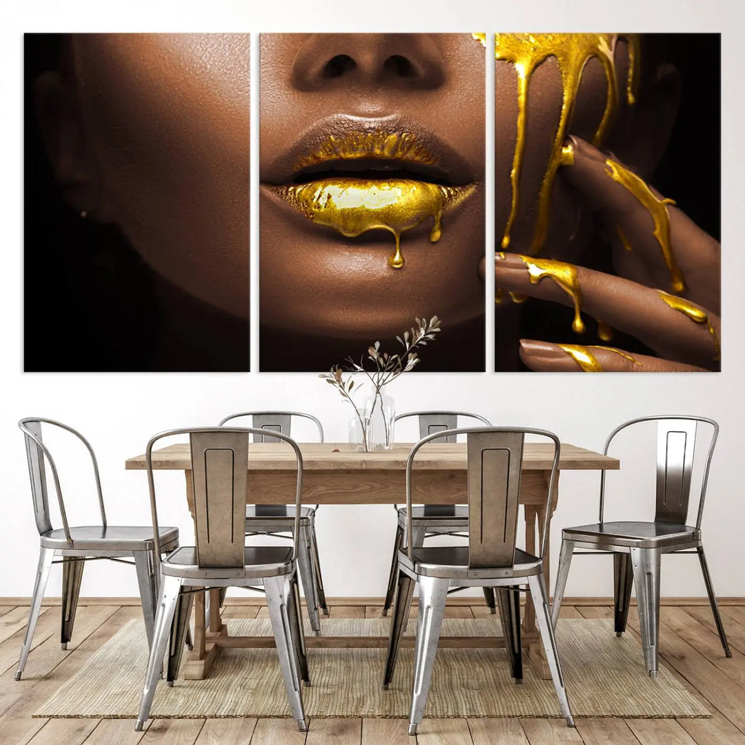 A triptych art display of the African American Art Black Woman Canvas Print, featuring gold-painted lips inspired by fashion and luxury, is elegantly arranged.