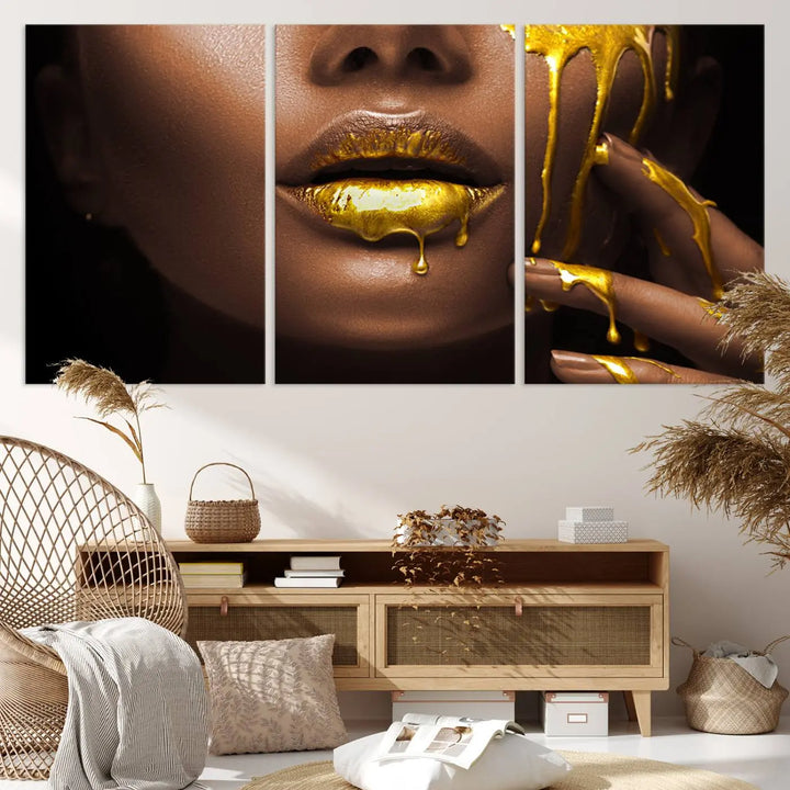 A triptych art display of the African American Art Black Woman Canvas Print, featuring gold-painted lips inspired by fashion and luxury, is elegantly arranged.