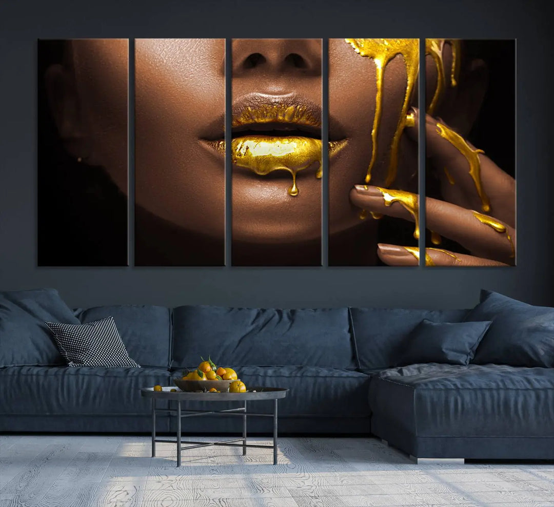 A triptych art display of the African American Art Black Woman Canvas Print, featuring gold-painted lips inspired by fashion and luxury, is elegantly arranged.