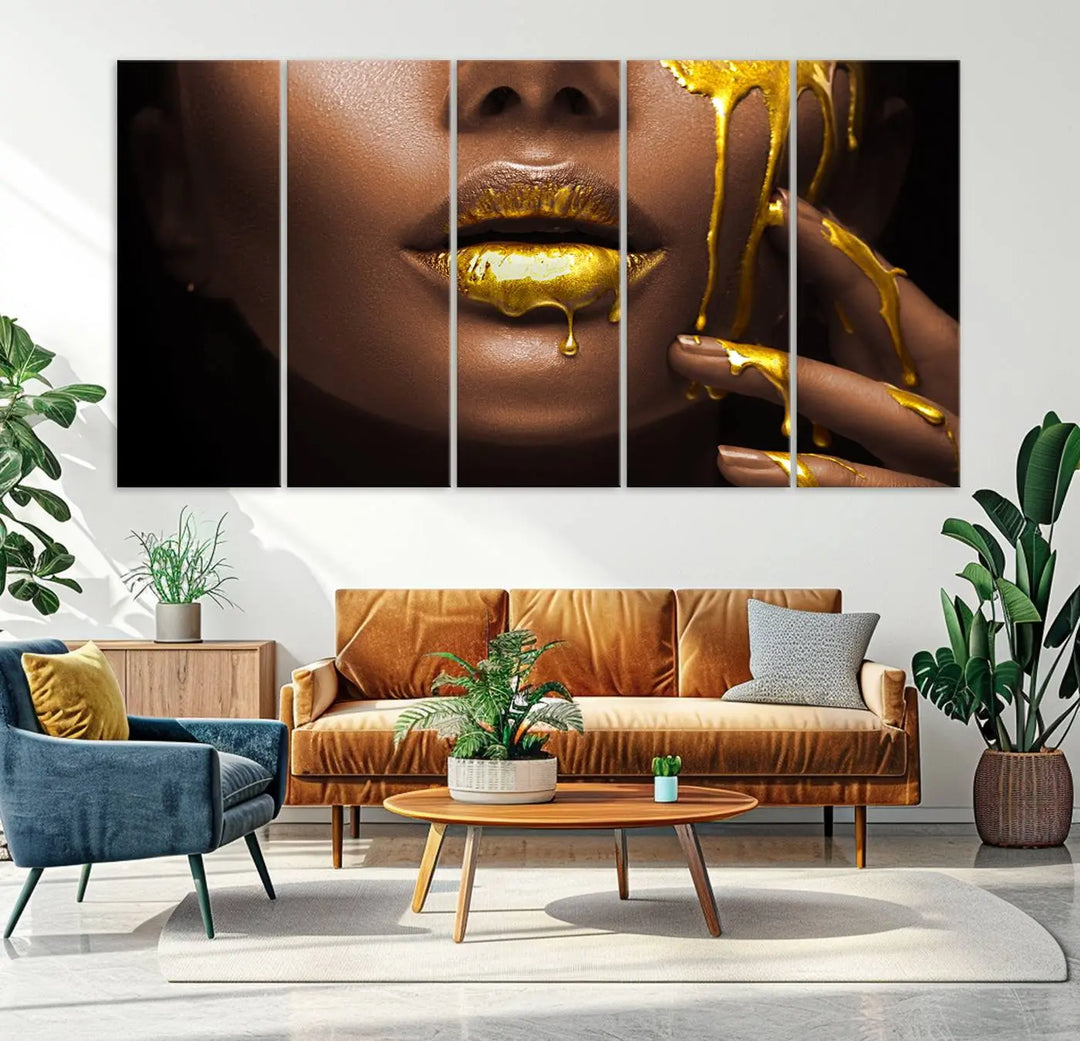 A triptych art display of the African American Art Black Woman Canvas Print, featuring gold-painted lips inspired by fashion and luxury, is elegantly arranged.