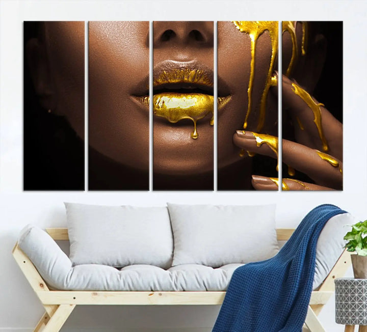 A triptych art display of the African American Art Black Woman Canvas Print, featuring gold-painted lips inspired by fashion and luxury, is elegantly arranged.