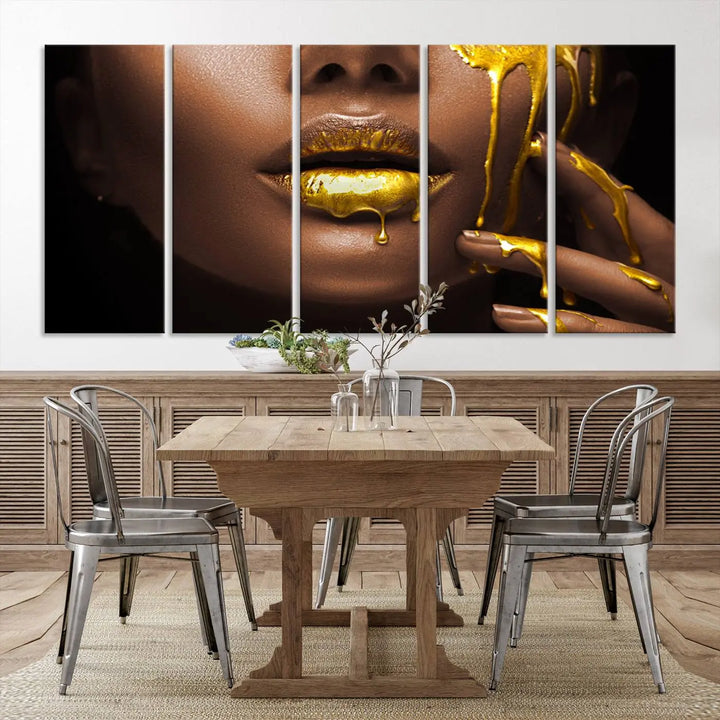 A triptych art display of the African American Art Black Woman Canvas Print, featuring gold-painted lips inspired by fashion and luxury, is elegantly arranged.