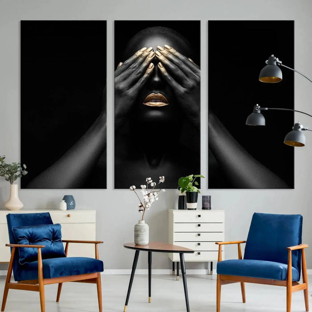 The African American Art Black and White Canvas Wall Art Gold Lips Art is a striking triptych featuring a woman with gold lips and nails covering her eyes.