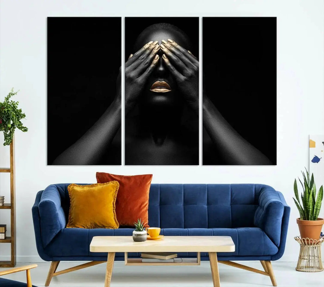 The African American Art Black and White Canvas Wall Art Gold Lips Art is a striking triptych featuring a woman with gold lips and nails covering her eyes.