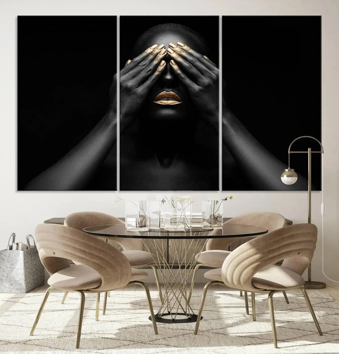 The African American Art Black and White Canvas Wall Art Gold Lips Art is a striking triptych featuring a woman with gold lips and nails covering her eyes.