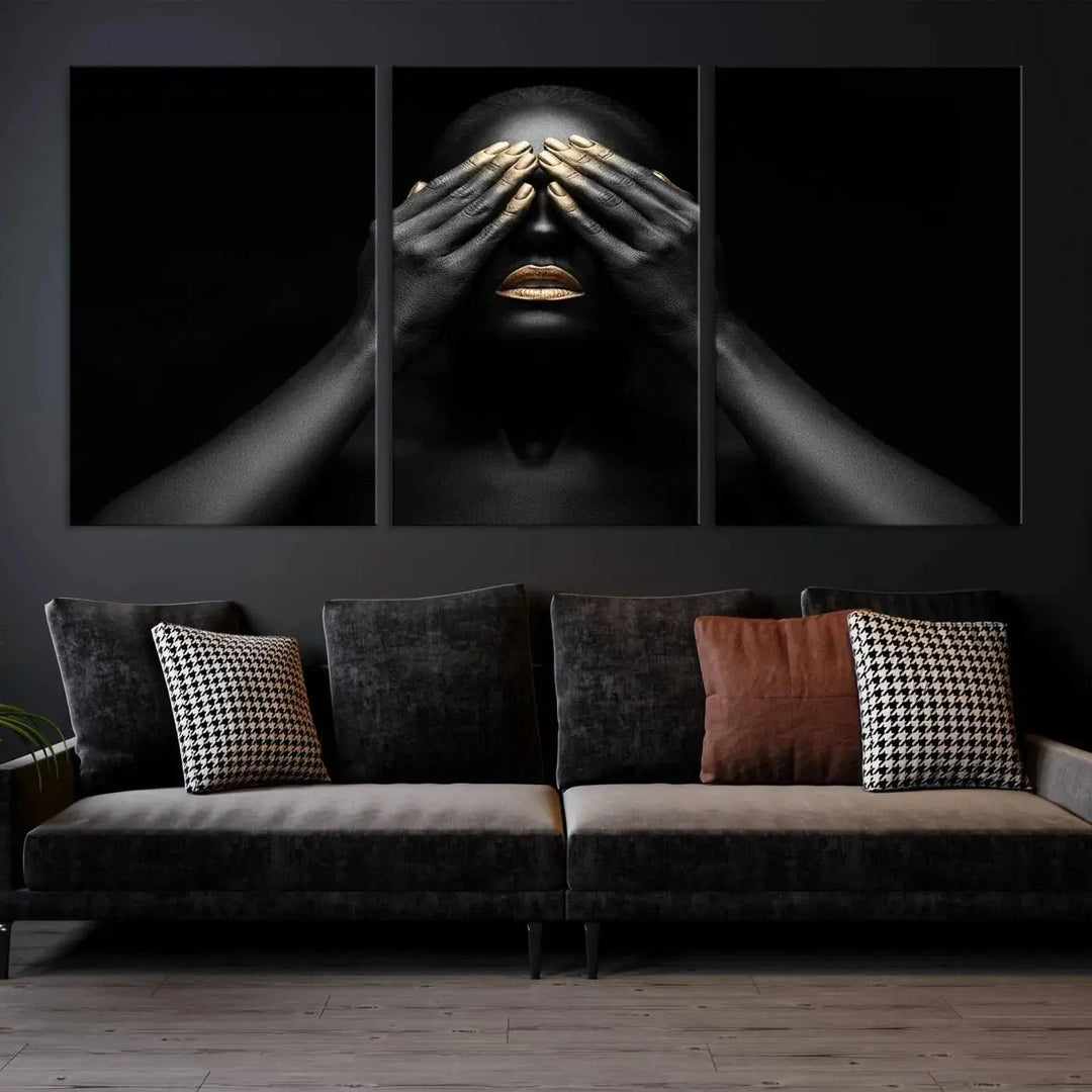 The African American Art Black and White Canvas Wall Art Gold Lips Art is a striking triptych featuring a woman with gold lips and nails covering her eyes.