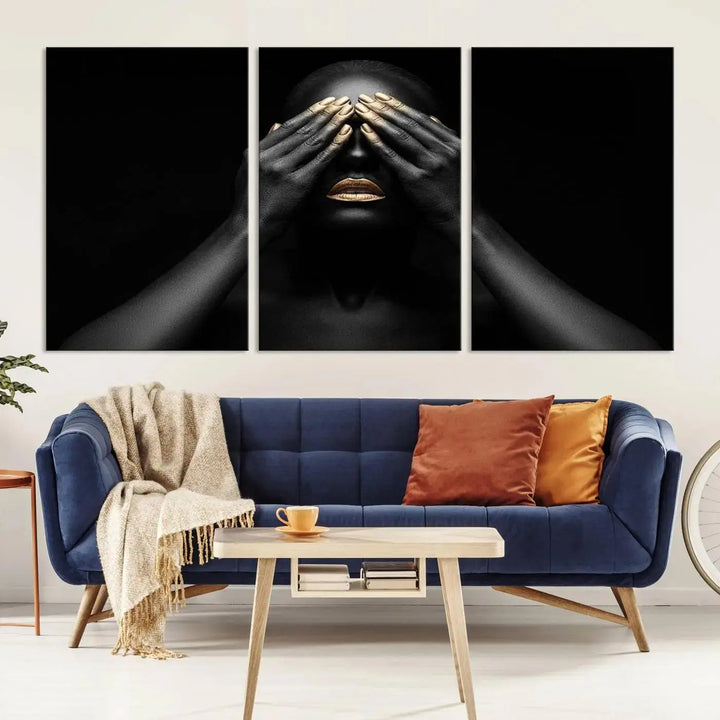 The African American Art Black and White Canvas Wall Art Gold Lips Art is a striking triptych featuring a woman with gold lips and nails covering her eyes.