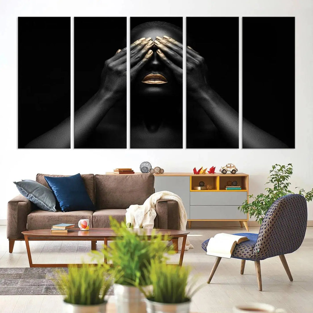 The African American Art Black and White Canvas Wall Art Gold Lips Art is a striking triptych featuring a woman with gold lips and nails covering her eyes.