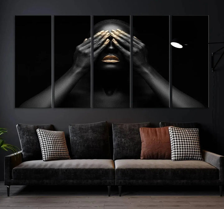 The African American Art Black and White Canvas Wall Art Gold Lips Art is a striking triptych featuring a woman with gold lips and nails covering her eyes.