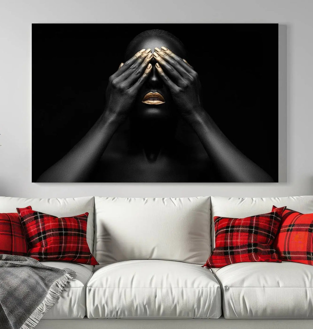 The African American Art Black and White Canvas Wall Art Gold Lips Art is a striking triptych featuring a woman with gold lips and nails covering her eyes.