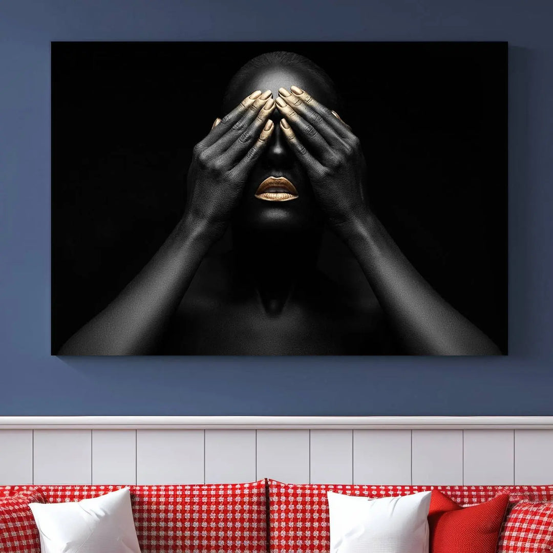 The African American Art Black and White Canvas Wall Art Gold Lips Art is a striking triptych featuring a woman with gold lips and nails covering her eyes.