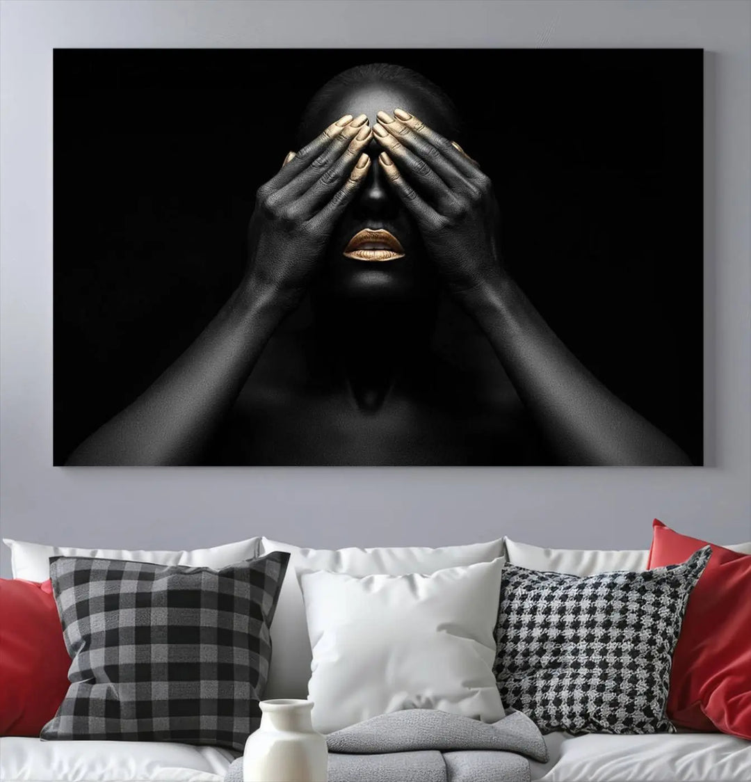 The African American Art Black and White Canvas Wall Art Gold Lips Art is a striking triptych featuring a woman with gold lips and nails covering her eyes.