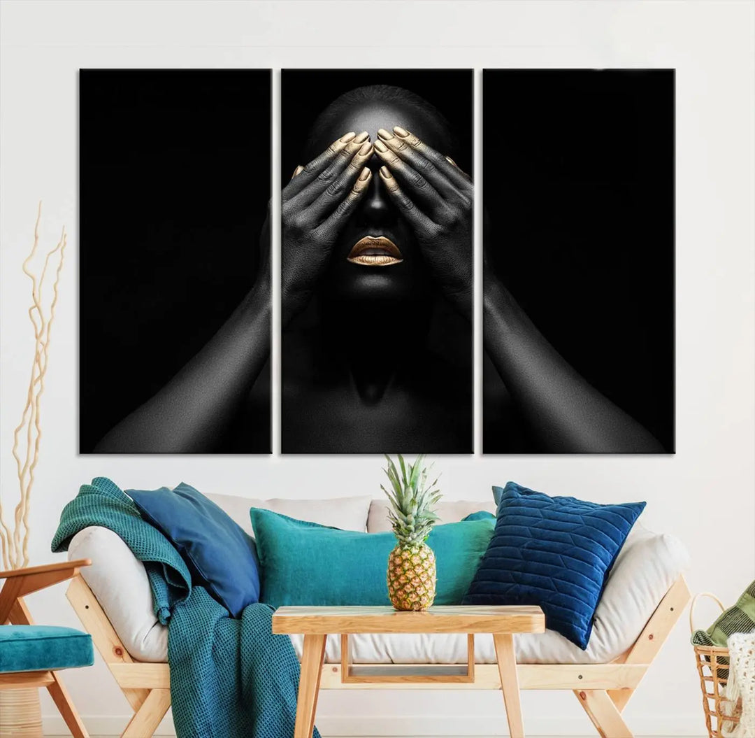 The African American Art Black and White Canvas Wall Art Gold Lips Art is a striking triptych featuring a woman with gold lips and nails covering her eyes.