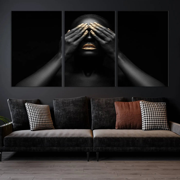 The African American Art Black and White Canvas Wall Art Gold Lips Art is a striking triptych featuring a woman with gold lips and nails covering her eyes.