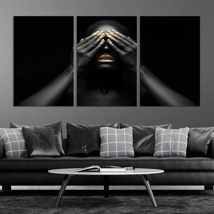 The African American Art Black and White Canvas Wall Art Gold Lips Art is a striking triptych featuring a woman with gold lips and nails covering her eyes.