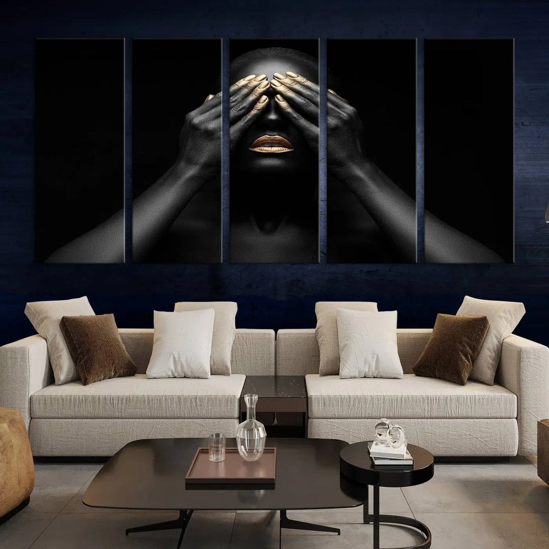 The African American Art Black and White Canvas Wall Art Gold Lips Art is a striking triptych featuring a woman with gold lips and nails covering her eyes.