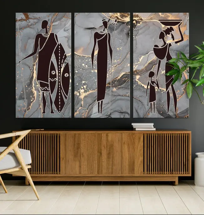 Discover the "African American Wall Art: African Women Painting Canvas Print," a stunning triptych that showcases silhouettes of African figures against abstract marble backgrounds in elegant gray and gold hues. This piece is crafted on museum-quality canvas, with each panel expertly gallery wrapped and coated with a UV-protective finish for long-lasting brilliance.