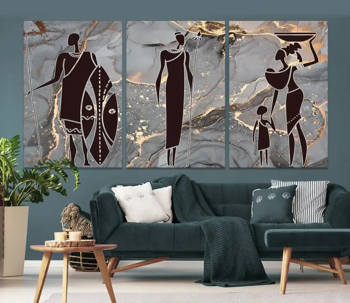 Discover the "African American Wall Art: African Women Painting Canvas Print," a stunning triptych that showcases silhouettes of African figures against abstract marble backgrounds in elegant gray and gold hues. This piece is crafted on museum-quality canvas, with each panel expertly gallery wrapped and coated with a UV-protective finish for long-lasting brilliance.