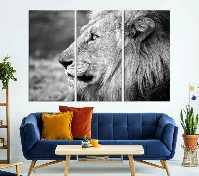 An African Lion Wall Art Canvas Print, featuring a black and white triptych of the lion's profile, is displayed above the modern couch.