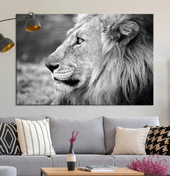 An African Lion Wall Art Canvas Print, featuring a black and white triptych of the lion's profile, is displayed above the modern couch.