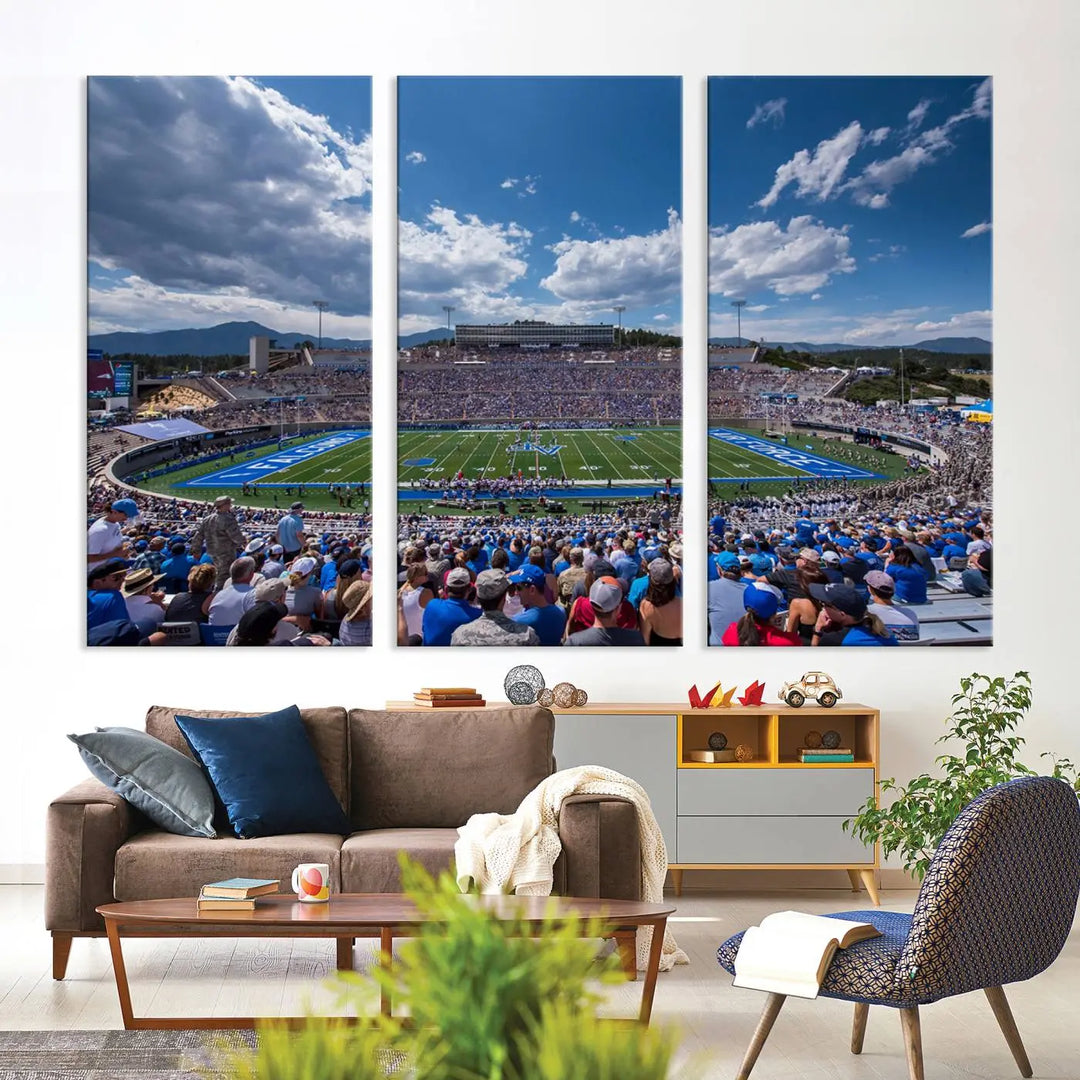 A modern living room showcases the Air Force Falcons Football Team Print, featuring Colorado Springs Falcon Stadium with clear blue skies, printed on museum-quality canvas.