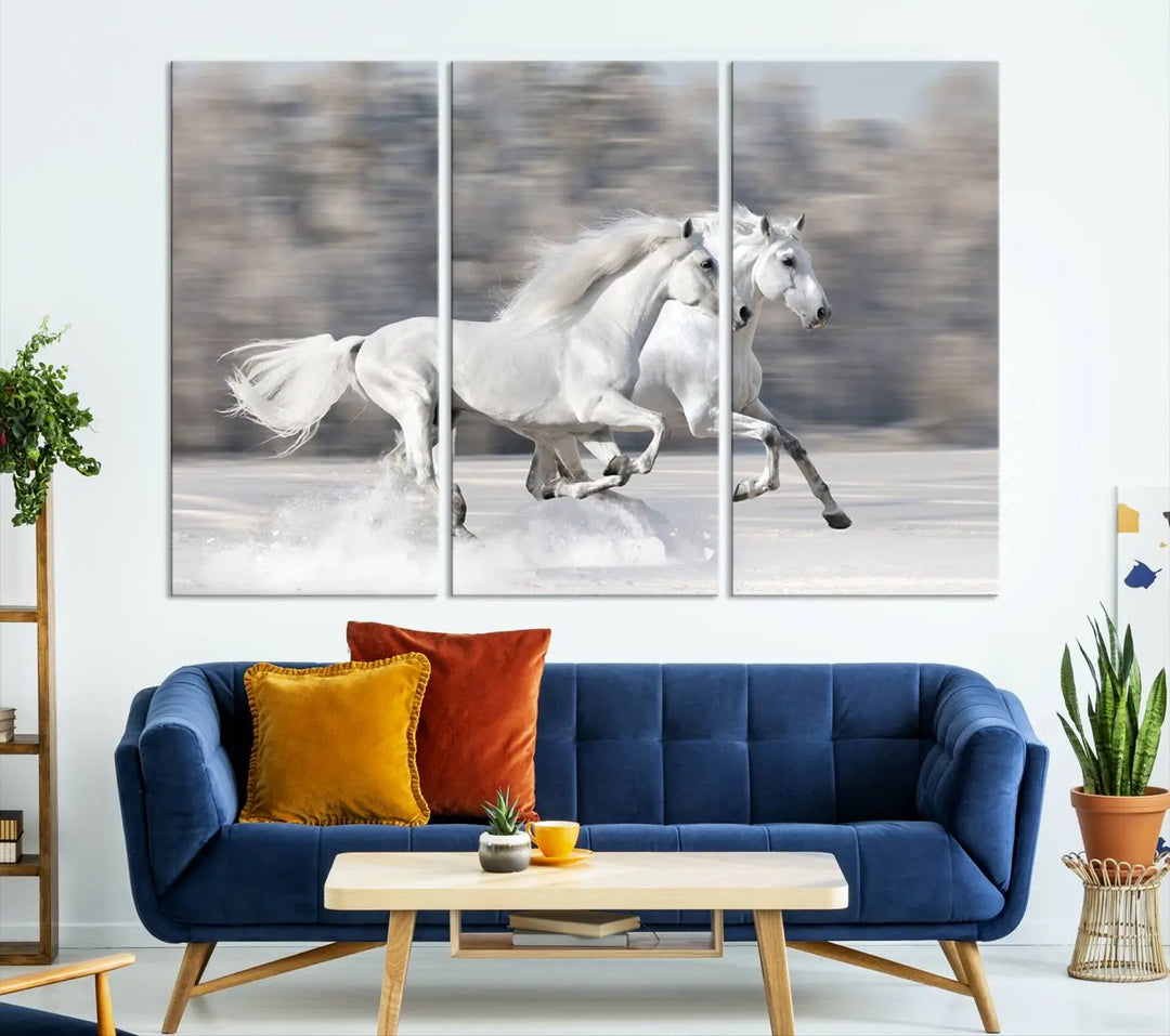 The "All The White Horses Wall Art Canvas Print" depicts a triptych of galloping white horses across a snowy landscape. These museum-quality canvases come with a UV-protective coating to maintain their stunning appearance over time.