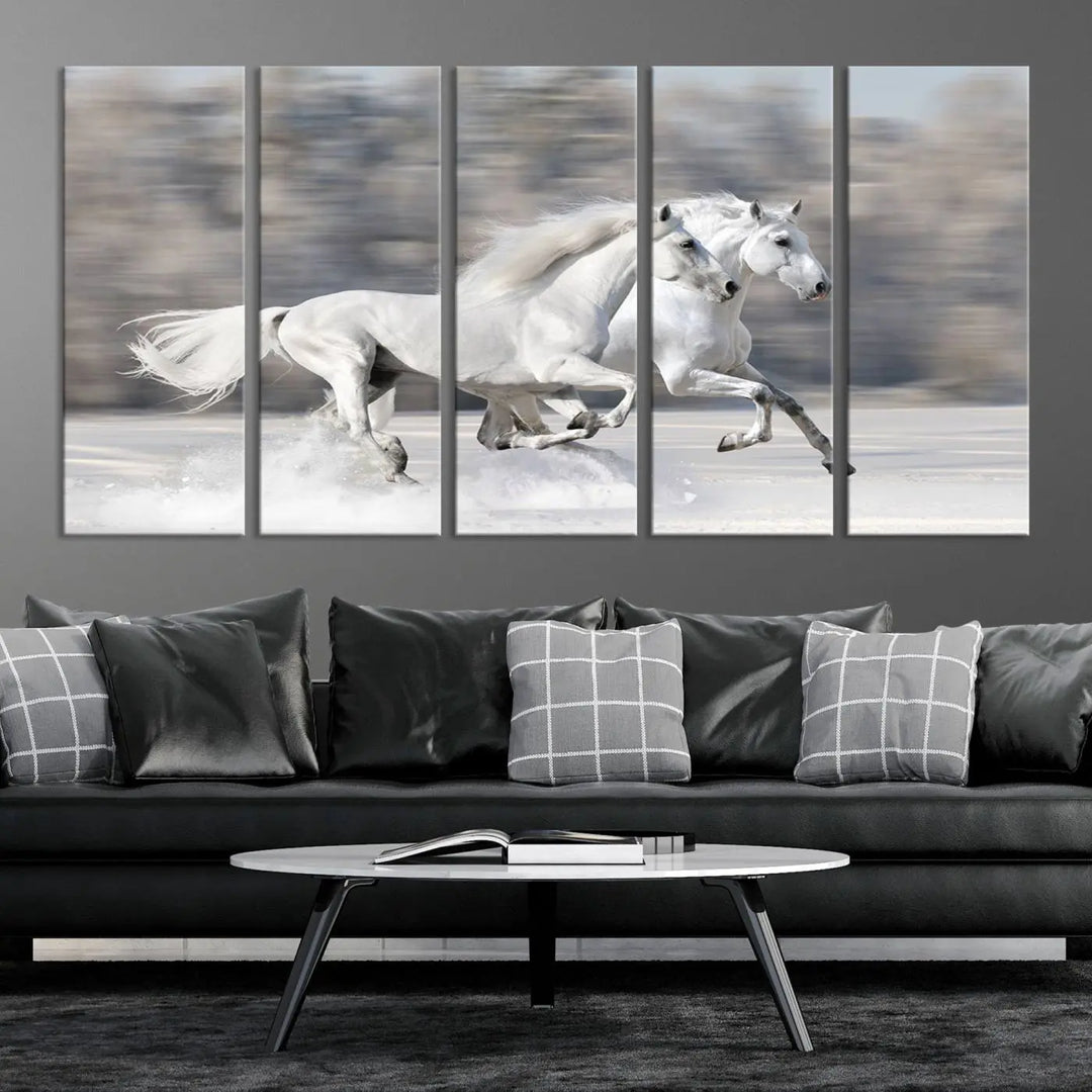 The "All The White Horses Wall Art Canvas Print" depicts a triptych of galloping white horses across a snowy landscape. These museum-quality canvases come with a UV-protective coating to maintain their stunning appearance over time.