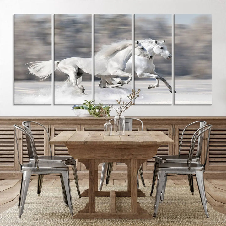 The "All The White Horses Wall Art Canvas Print" depicts a triptych of galloping white horses across a snowy landscape. These museum-quality canvases come with a UV-protective coating to maintain their stunning appearance over time.