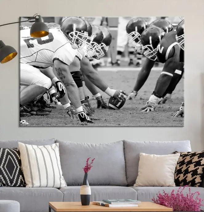 The "American Football Player Wall Art Canvas Print," beautifully rendered in black and white, captures a football scrimmage line and is printed on museum-quality canvas. This artwork is divided into three stunning panels and comes ready to hang for easy integration into your space.