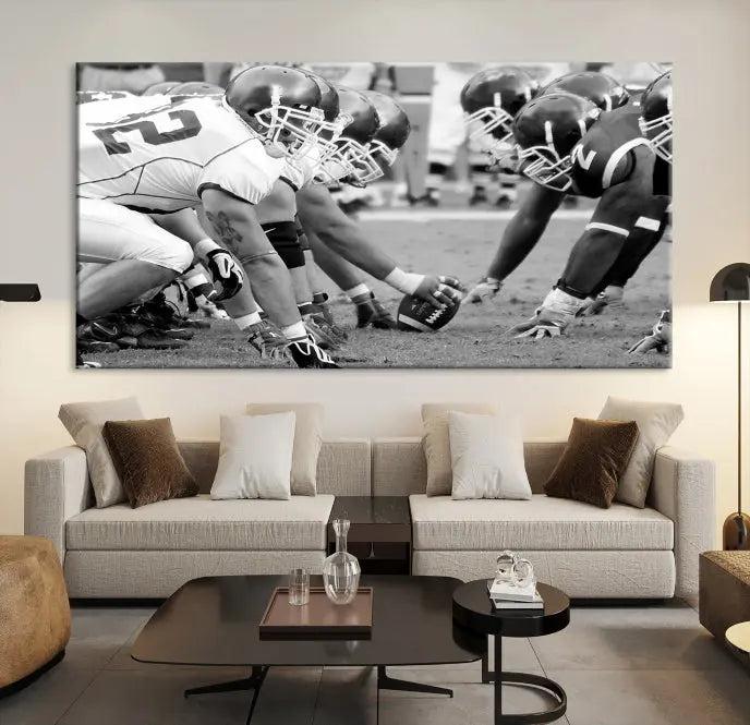 The "American Football Player Wall Art Canvas Print," beautifully rendered in black and white, captures a football scrimmage line and is printed on museum-quality canvas. This artwork is divided into three stunning panels and comes ready to hang for easy integration into your space.