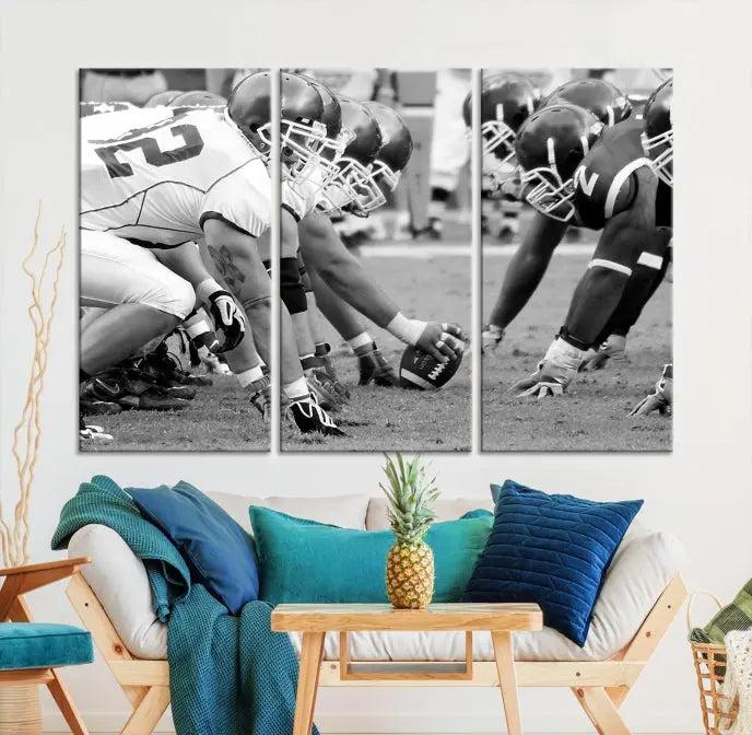 The "American Football Player Wall Art Canvas Print," beautifully rendered in black and white, captures a football scrimmage line and is printed on museum-quality canvas. This artwork is divided into three stunning panels and comes ready to hang for easy integration into your space.