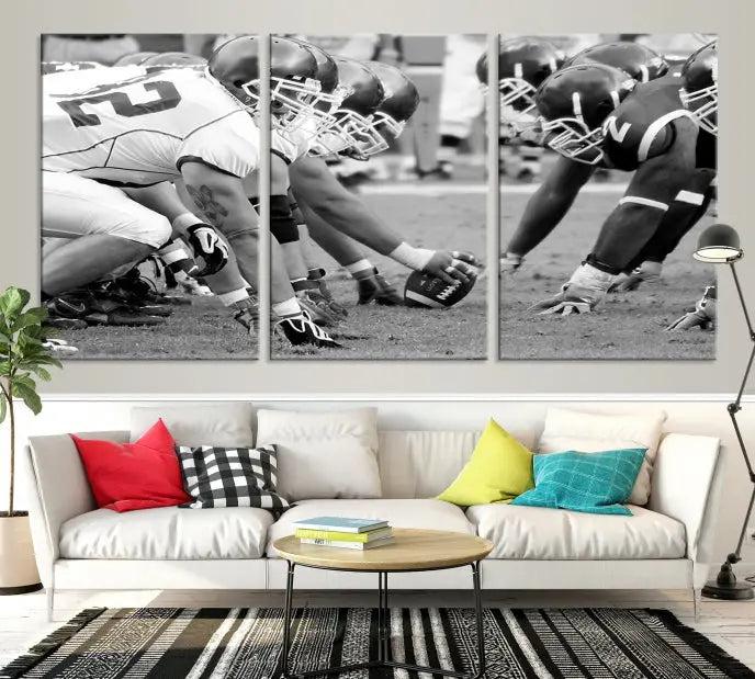 The "American Football Player Wall Art Canvas Print," beautifully rendered in black and white, captures a football scrimmage line and is printed on museum-quality canvas. This artwork is divided into three stunning panels and comes ready to hang for easy integration into your space.