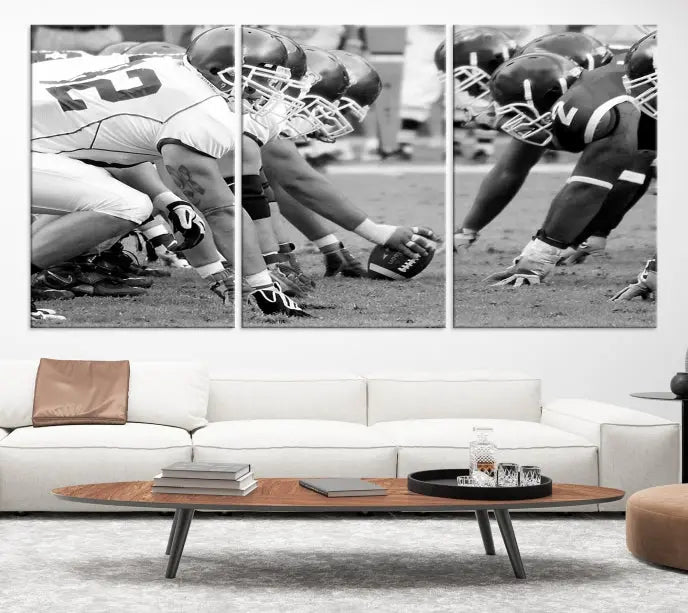 The "American Football Player Wall Art Canvas Print," beautifully rendered in black and white, captures a football scrimmage line and is printed on museum-quality canvas. This artwork is divided into three stunning panels and comes ready to hang for easy integration into your space.