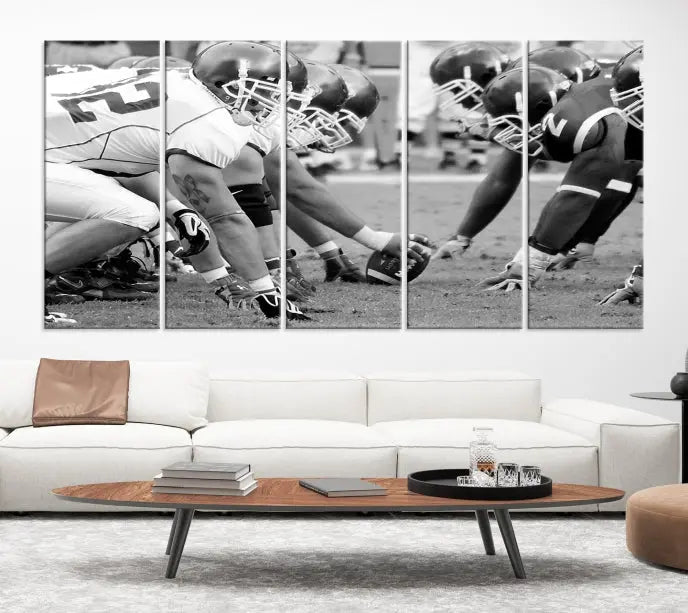 The "American Football Player Wall Art Canvas Print," beautifully rendered in black and white, captures a football scrimmage line and is printed on museum-quality canvas. This artwork is divided into three stunning panels and comes ready to hang for easy integration into your space.