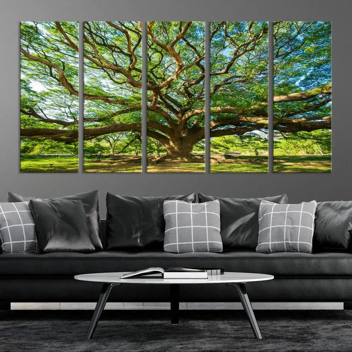 The Angel Oak Tree Wall Art, a multi-panel canvas print showcasing a large tree with sprawling branches and green leaves in a style reminiscent of the majestic Angel Oak Tree, elegantly adorns the wooden wall in the living room.