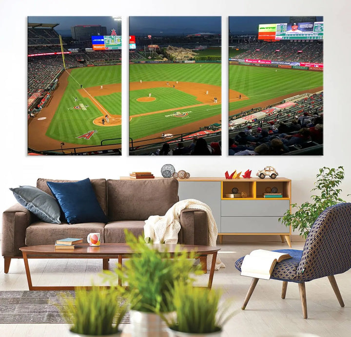 The living room features a sports-themed decor with a framed, ready-to-hang triptych of the Angel Stadium Aerial View – Los Angeles Angels Baseball Canvas Print.