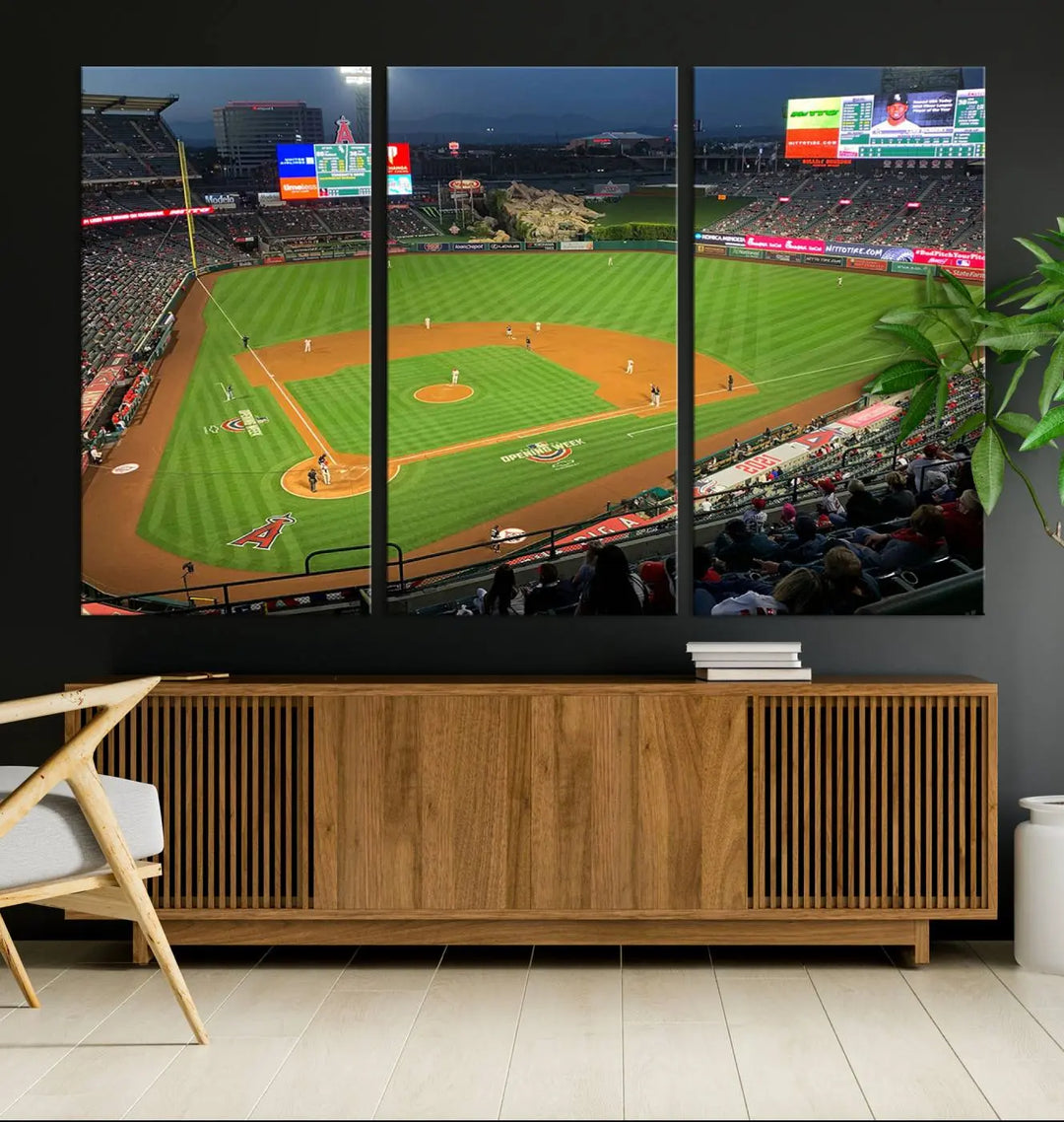 The living room features a sports-themed decor with a framed, ready-to-hang triptych of the Angel Stadium Aerial View – Los Angeles Angels Baseball Canvas Print.