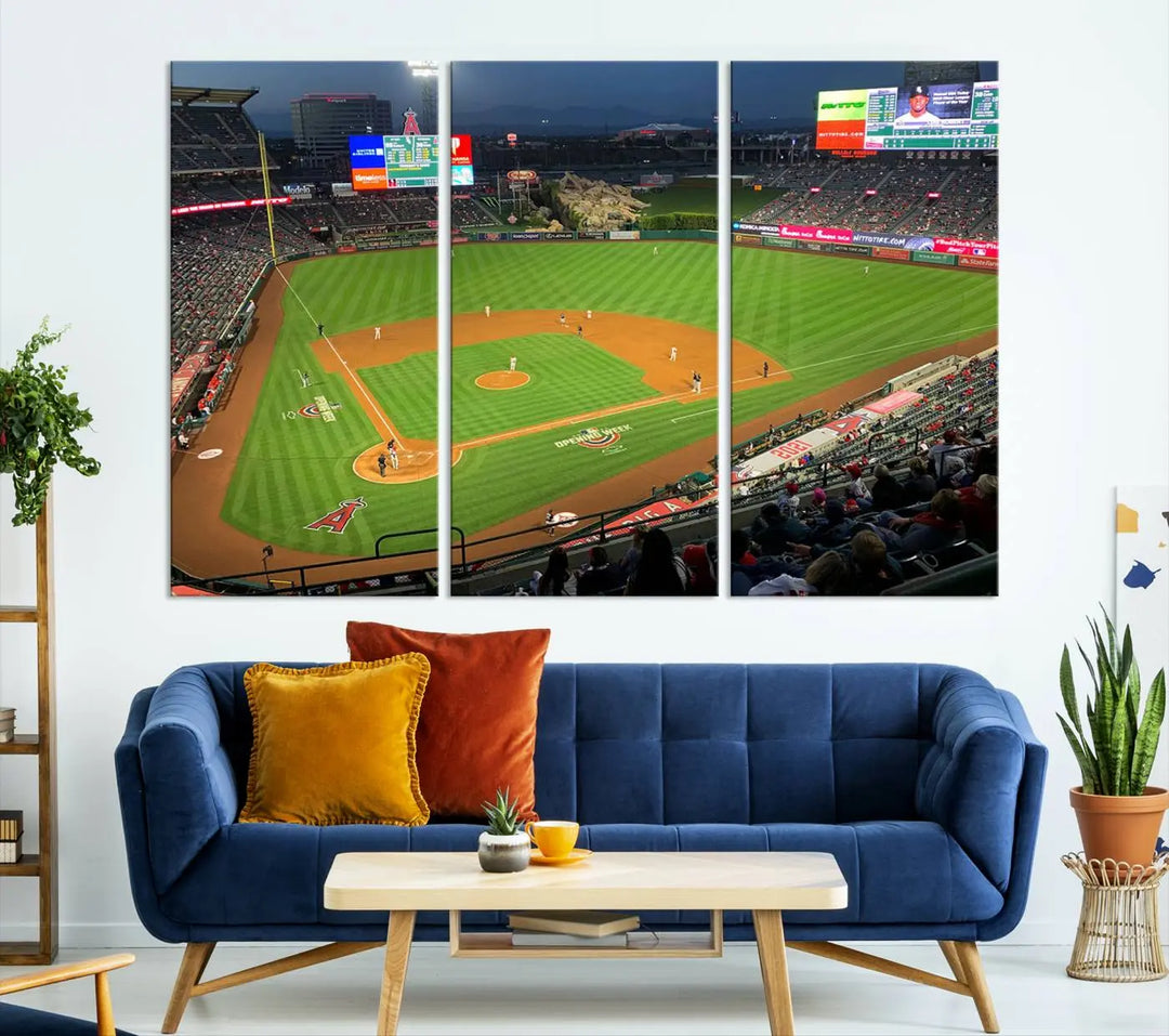 The living room features a sports-themed decor with a framed, ready-to-hang triptych of the Angel Stadium Aerial View – Los Angeles Angels Baseball Canvas Print.