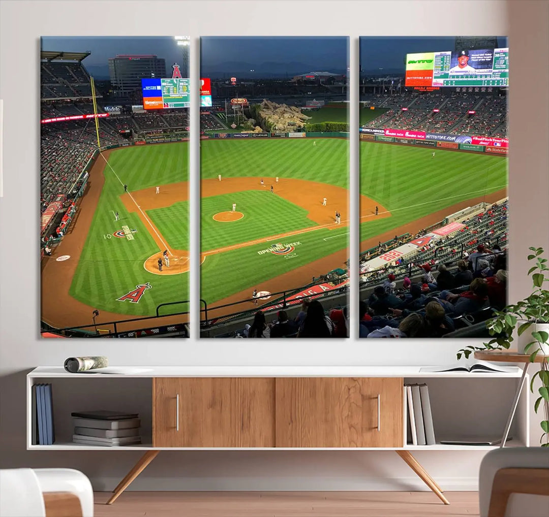 The living room features a sports-themed decor with a framed, ready-to-hang triptych of the Angel Stadium Aerial View – Los Angeles Angels Baseball Canvas Print.