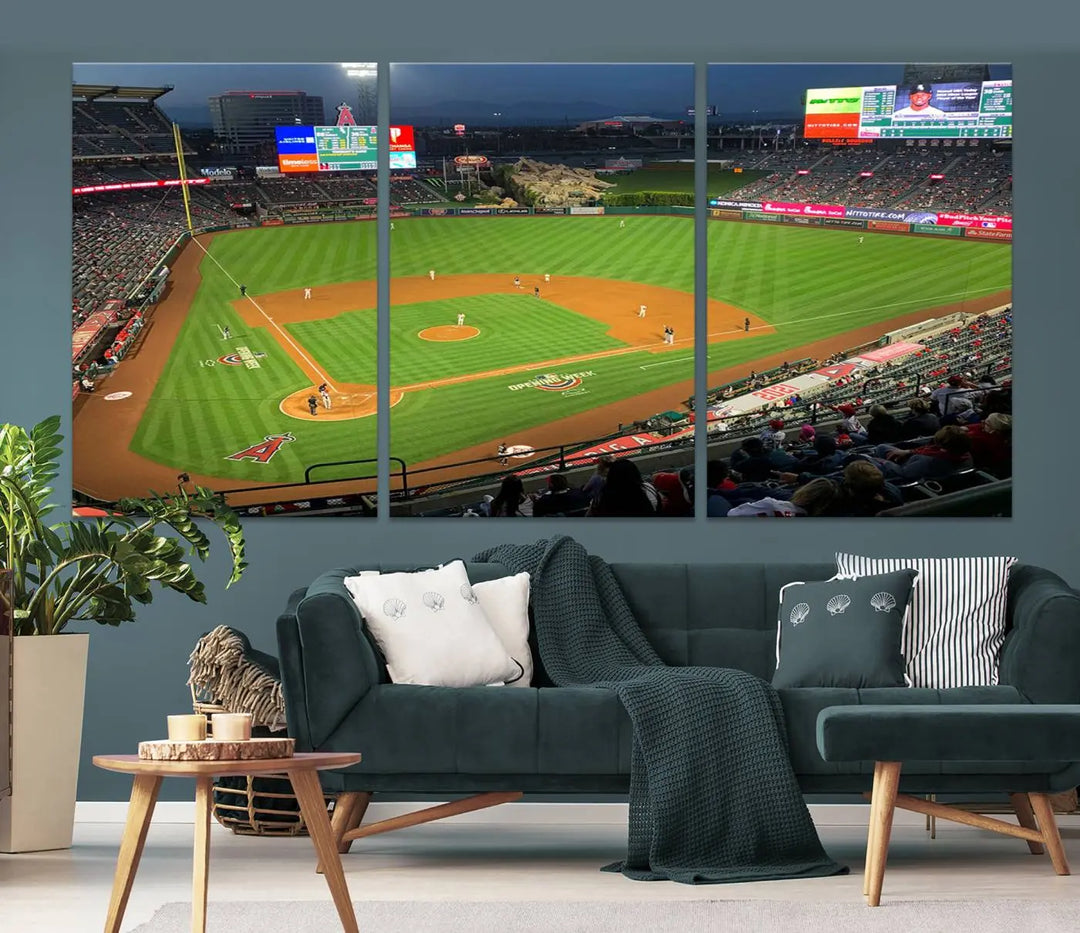 The living room features a sports-themed decor with a framed, ready-to-hang triptych of the Angel Stadium Aerial View – Los Angeles Angels Baseball Canvas Print.