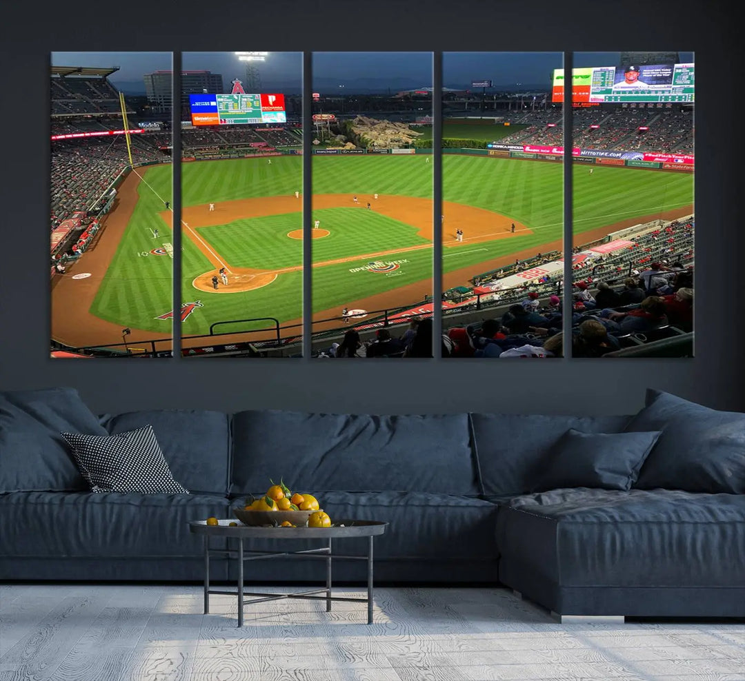 The living room features a sports-themed decor with a framed, ready-to-hang triptych of the Angel Stadium Aerial View – Los Angeles Angels Baseball Canvas Print.