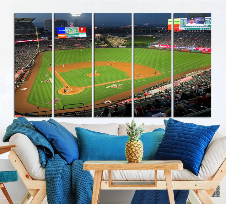 The living room features a sports-themed decor with a framed, ready-to-hang triptych of the Angel Stadium Aerial View – Los Angeles Angels Baseball Canvas Print.