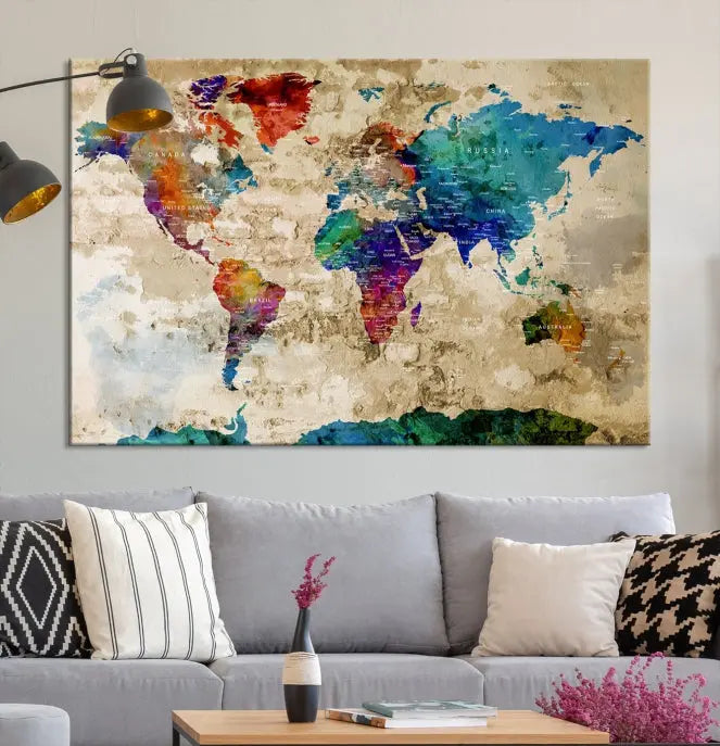 The contemporary living room showcases the "Watercolor Wall Art Push Pin World Map w/ Antarctica Canvas Print" on the wall. This museum-quality canvas is equipped with a UV-protective coating, guaranteeing vibrant colors endure for years, and it's ready to hang for an immediate style enhancement.