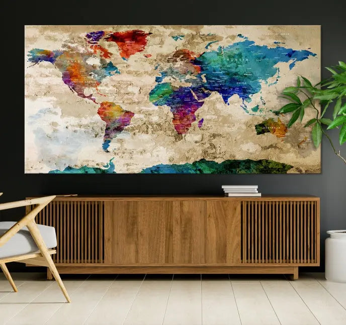 The contemporary living room showcases the "Watercolor Wall Art Push Pin World Map w/ Antarctica Canvas Print" on the wall. This museum-quality canvas is equipped with a UV-protective coating, guaranteeing vibrant colors endure for years, and it's ready to hang for an immediate style enhancement.