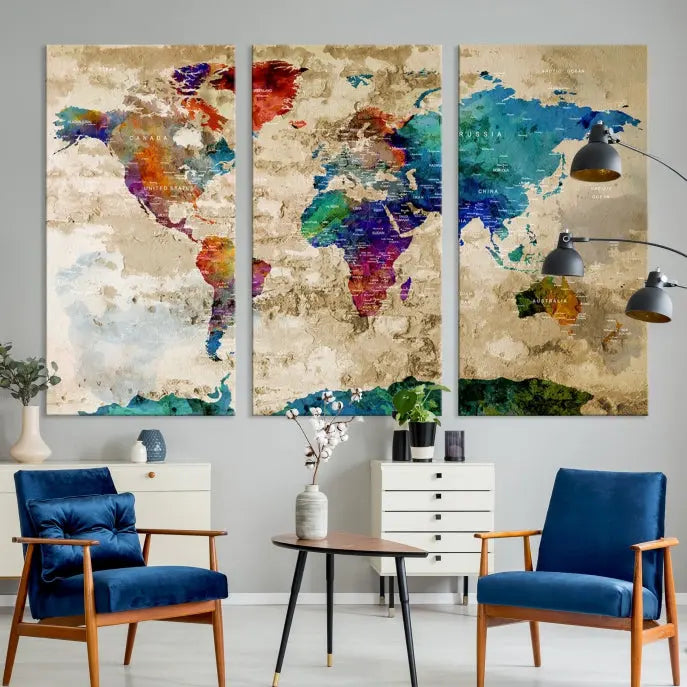 The contemporary living room showcases the "Watercolor Wall Art Push Pin World Map w/ Antarctica Canvas Print" on the wall. This museum-quality canvas is equipped with a UV-protective coating, guaranteeing vibrant colors endure for years, and it's ready to hang for an immediate style enhancement.