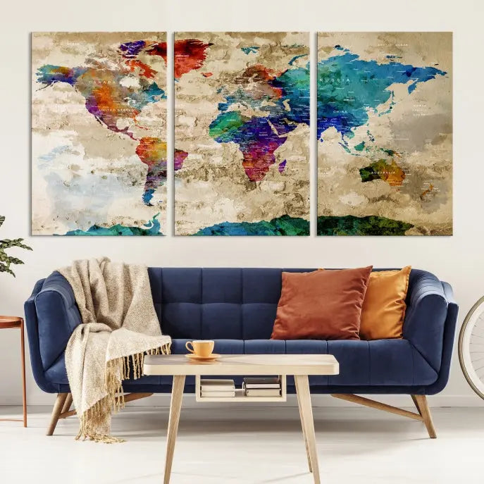 The contemporary living room showcases the "Watercolor Wall Art Push Pin World Map w/ Antarctica Canvas Print" on the wall. This museum-quality canvas is equipped with a UV-protective coating, guaranteeing vibrant colors endure for years, and it's ready to hang for an immediate style enhancement.