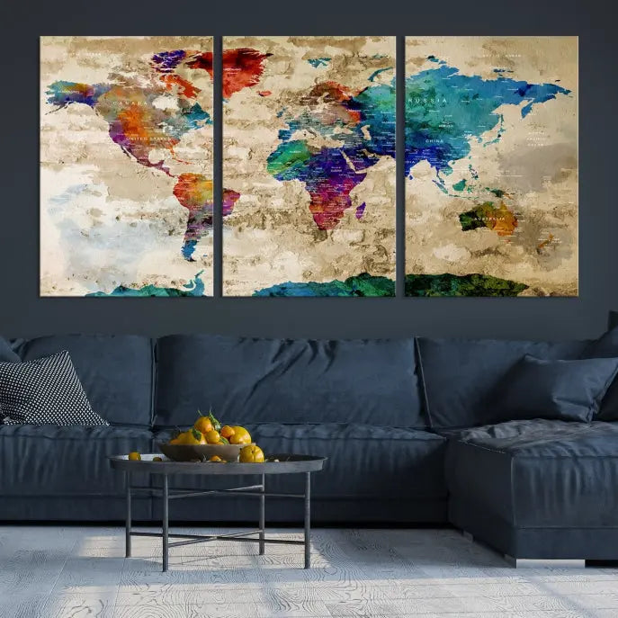 The contemporary living room showcases the "Watercolor Wall Art Push Pin World Map w/ Antarctica Canvas Print" on the wall. This museum-quality canvas is equipped with a UV-protective coating, guaranteeing vibrant colors endure for years, and it's ready to hang for an immediate style enhancement.