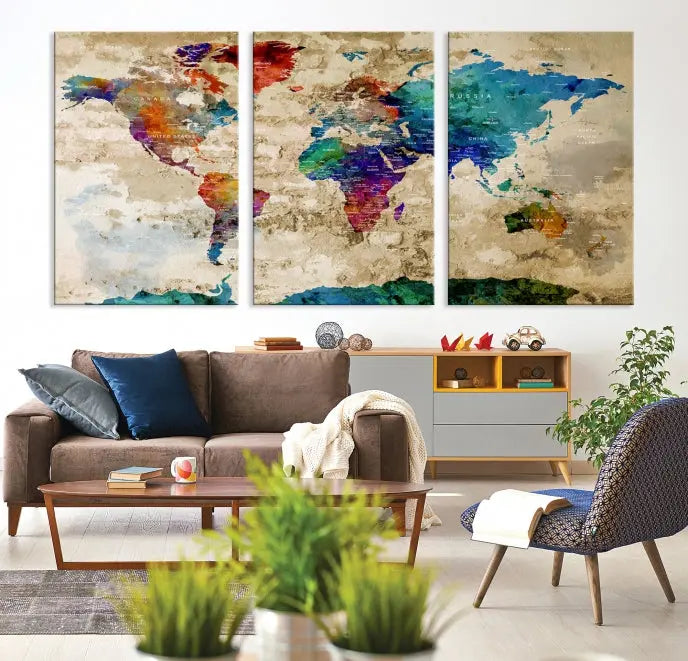 The contemporary living room showcases the "Watercolor Wall Art Push Pin World Map w/ Antarctica Canvas Print" on the wall. This museum-quality canvas is equipped with a UV-protective coating, guaranteeing vibrant colors endure for years, and it's ready to hang for an immediate style enhancement.