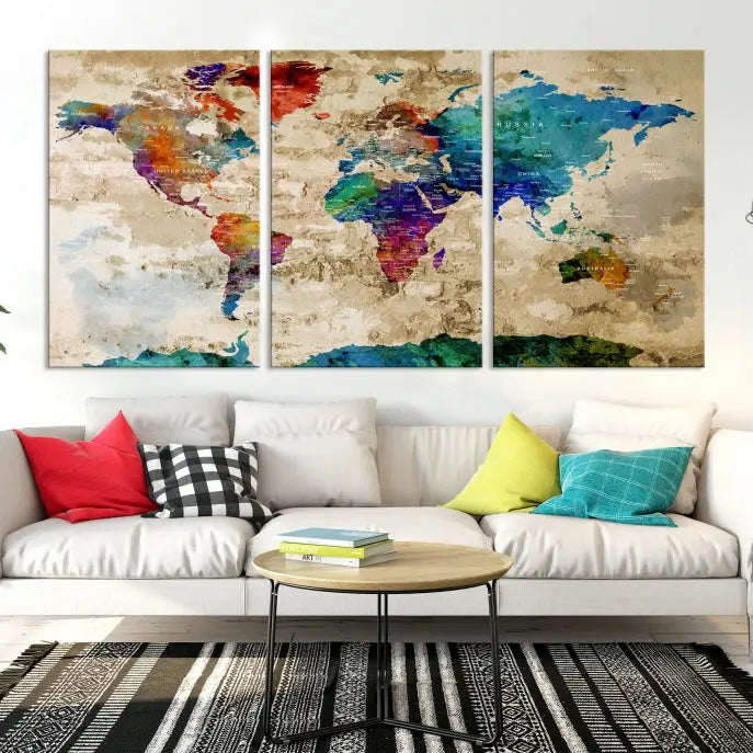 The contemporary living room showcases the "Watercolor Wall Art Push Pin World Map w/ Antarctica Canvas Print" on the wall. This museum-quality canvas is equipped with a UV-protective coating, guaranteeing vibrant colors endure for years, and it's ready to hang for an immediate style enhancement.