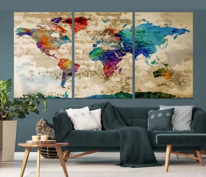 The contemporary living room showcases the "Watercolor Wall Art Push Pin World Map w/ Antarctica Canvas Print" on the wall. This museum-quality canvas is equipped with a UV-protective coating, guaranteeing vibrant colors endure for years, and it's ready to hang for an immediate style enhancement.